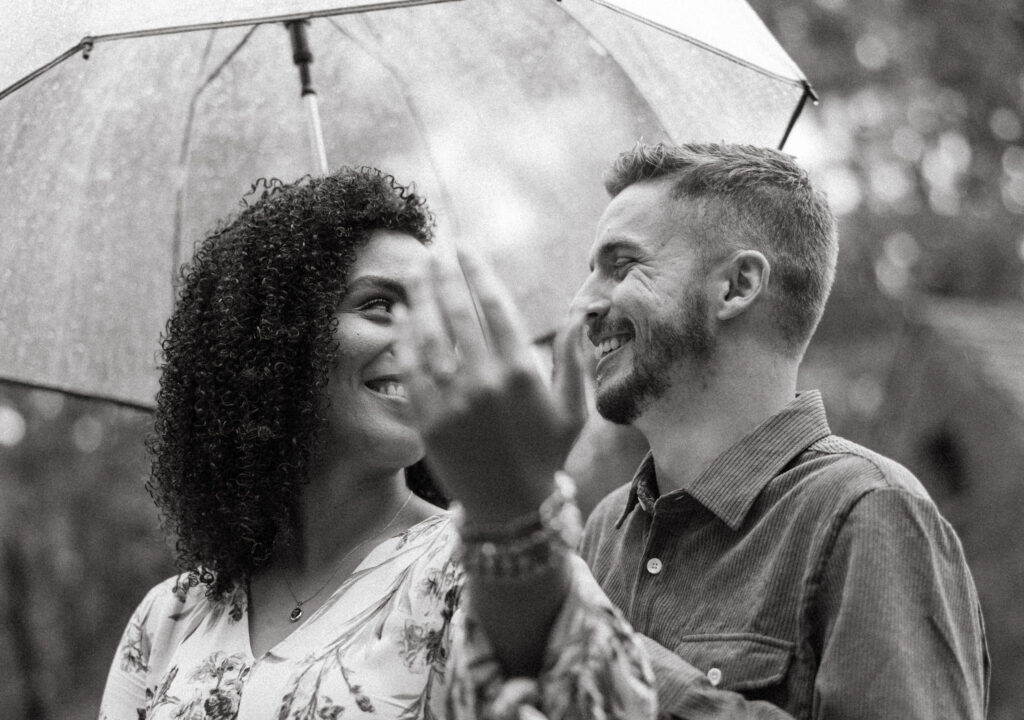 surprise engagement photos in little rock arkansas in the rain