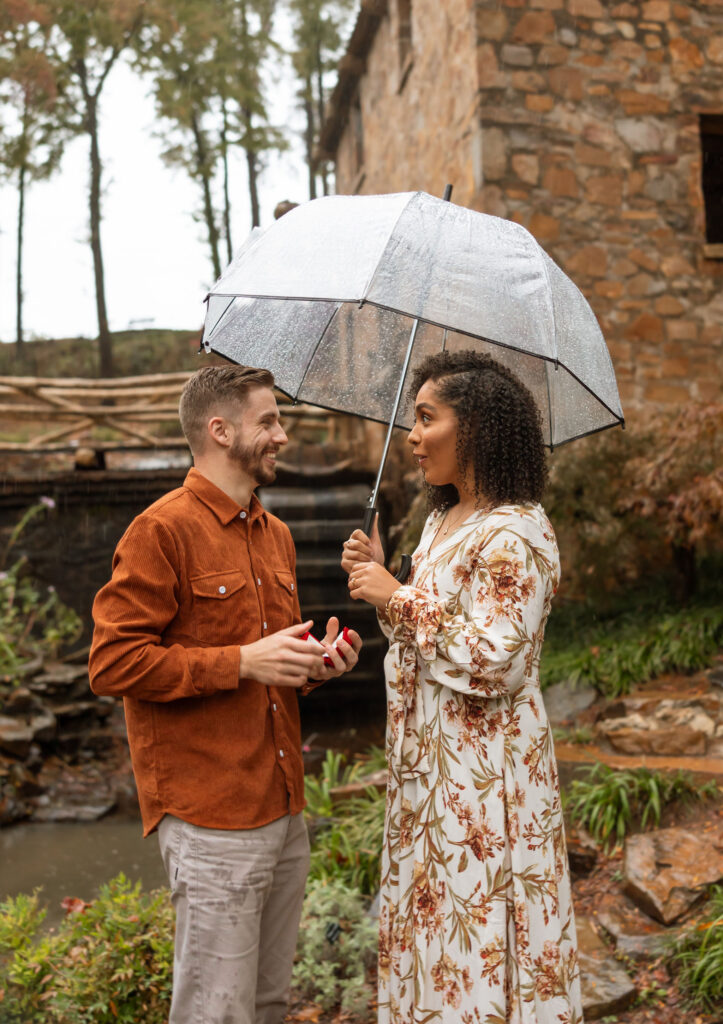 documentary style engagement photos in the rain