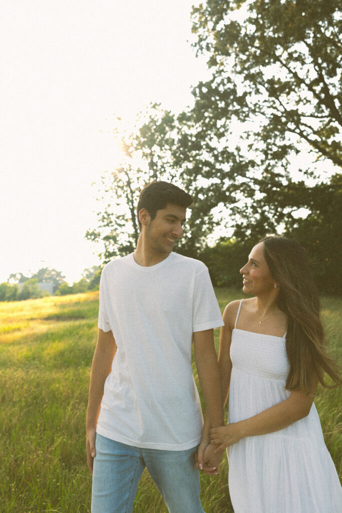 field spring couples photoshoot couple holding hands