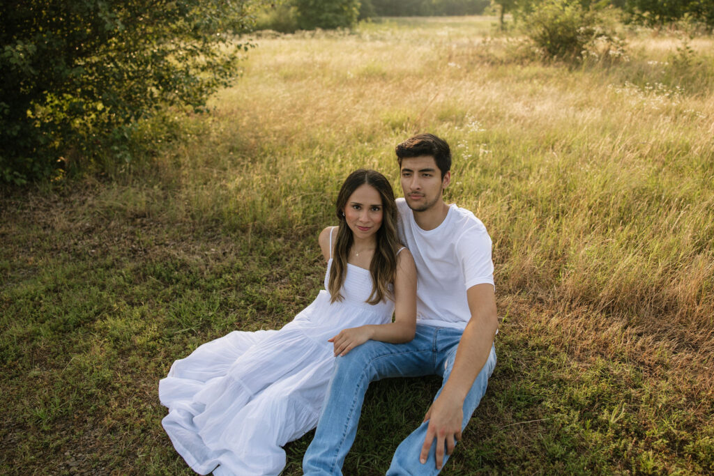 spring couples photoshoot in a field during golden hour