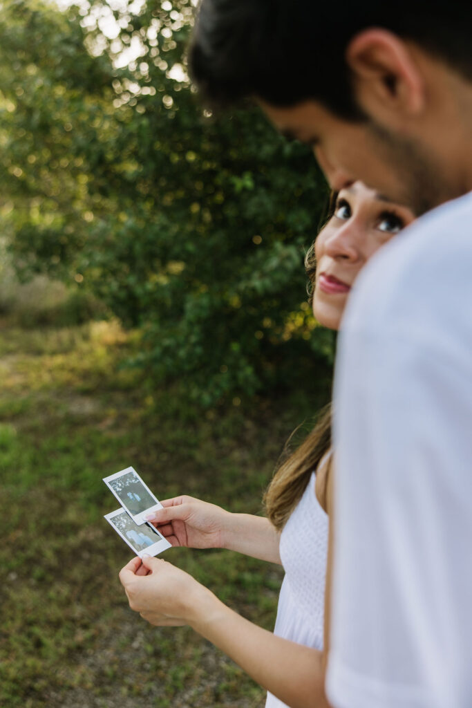 vintage polaroid couples photoshoot in a field