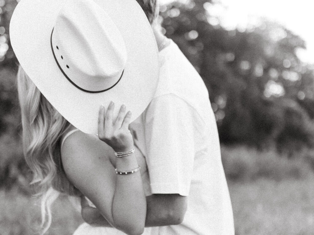 golden hour arkansas engagement photos with cowboy boots