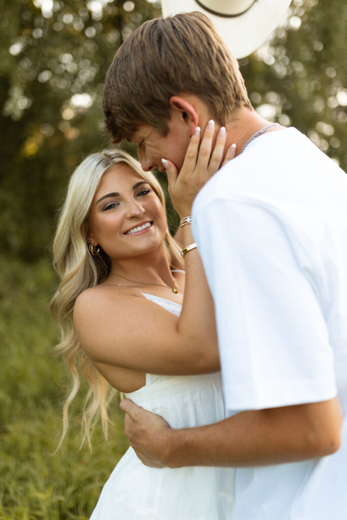 golden hour arkansas engagement photos with cowboy boots