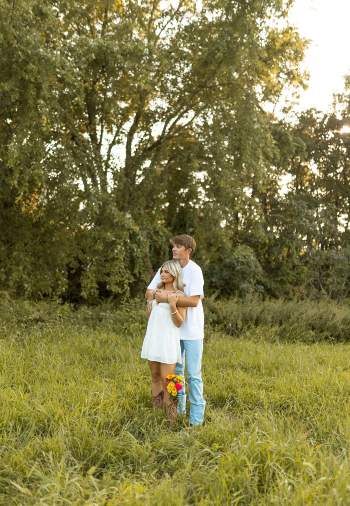 golden hour arkansas engagement photos with cowboy boots