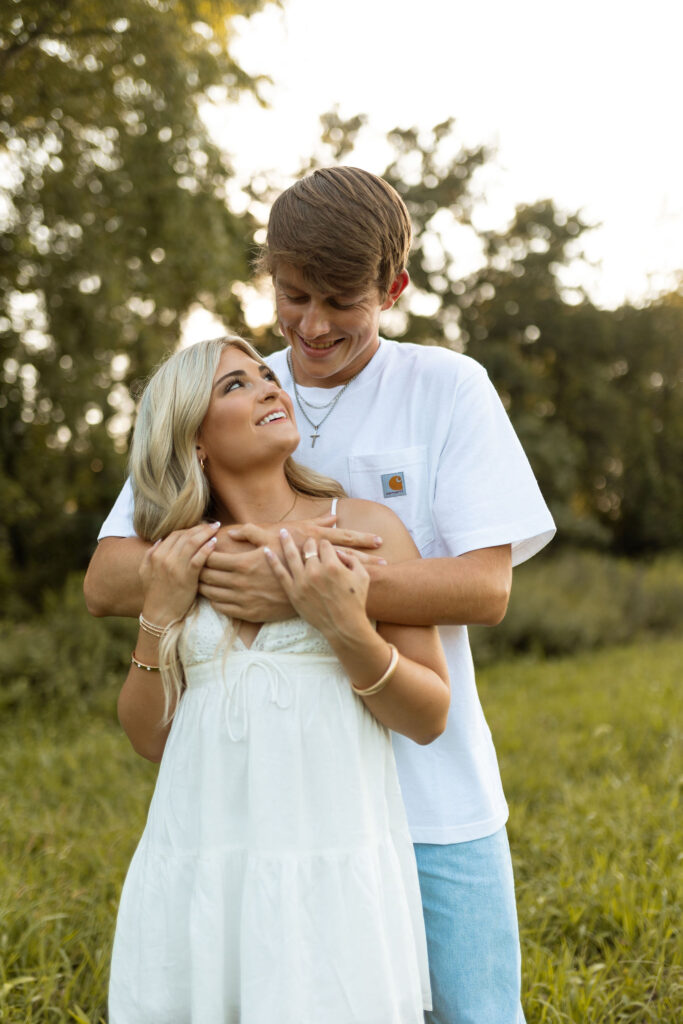 golden hour arkansas engagement photos with cowboy boots