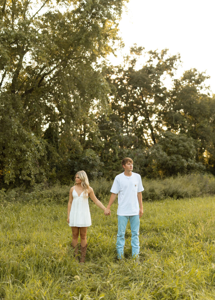 documentary style engagement photos in arkansas during golden hour