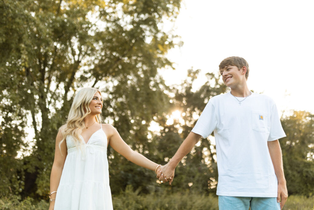 documentary style engagement photos in arkansas during golden hour