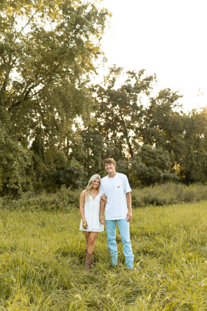 documentary style engagement photos in arkansas during golden hour