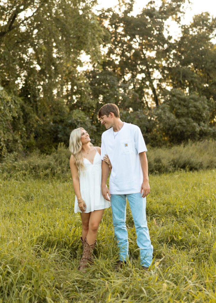 documentary style engagement photos in arkansas during golden hour