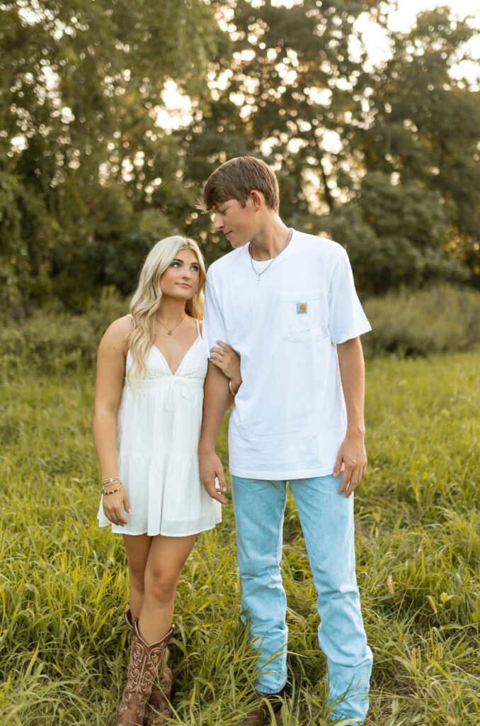 documentary style engagement photos in arkansas during golden hour