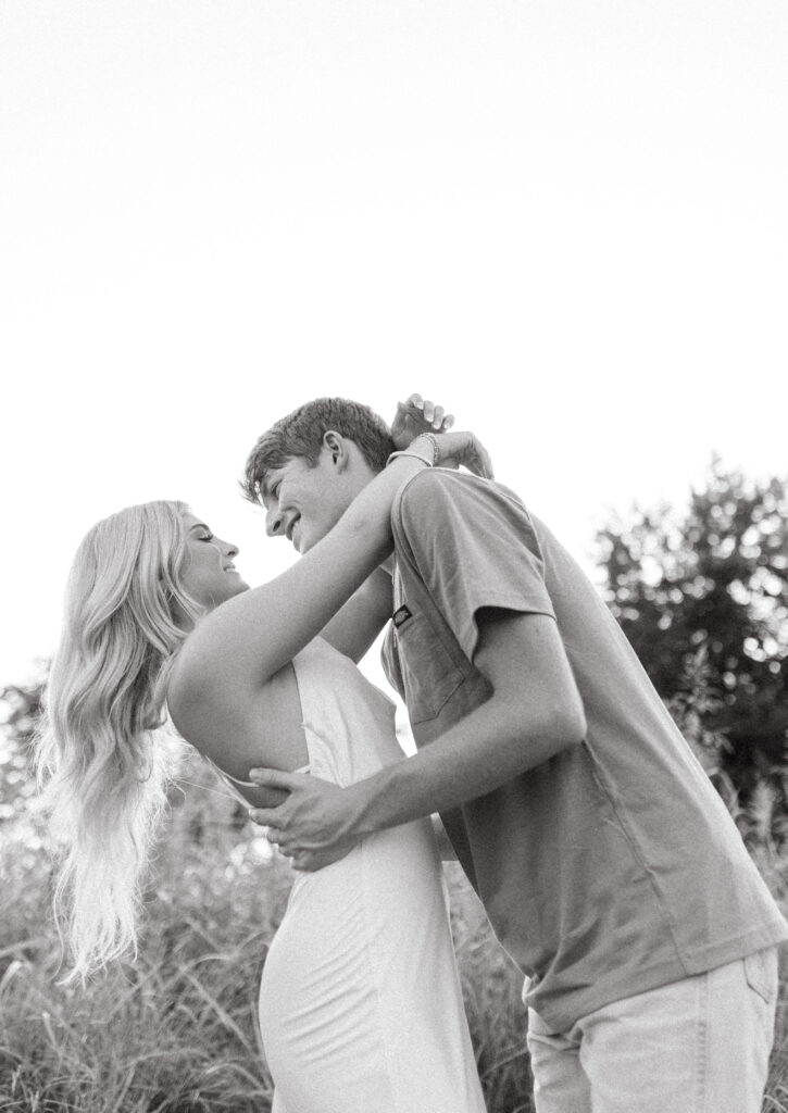 engagement photos in northwest arkansas in a field