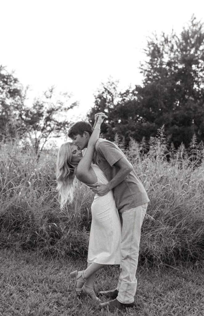 engagement photos in northwest arkansas in a field