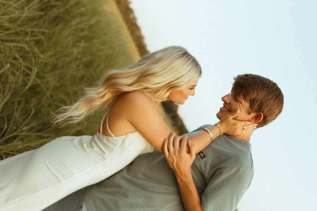 engagement photos in northwest arkansas in a field