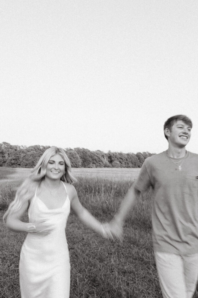 field sunset engagement photos poses running
