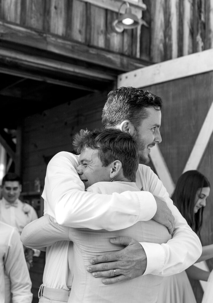 bride and groom celebrating first kiss at wedding ceremony