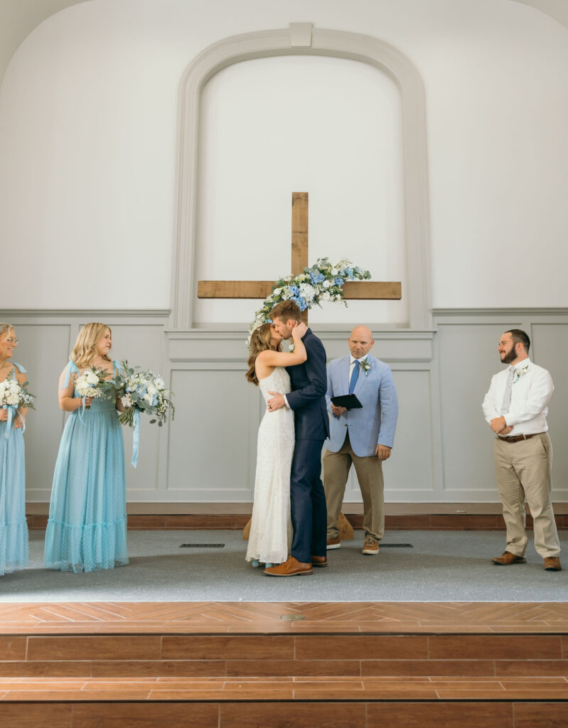 bride and groom first kiss wedding ceremony