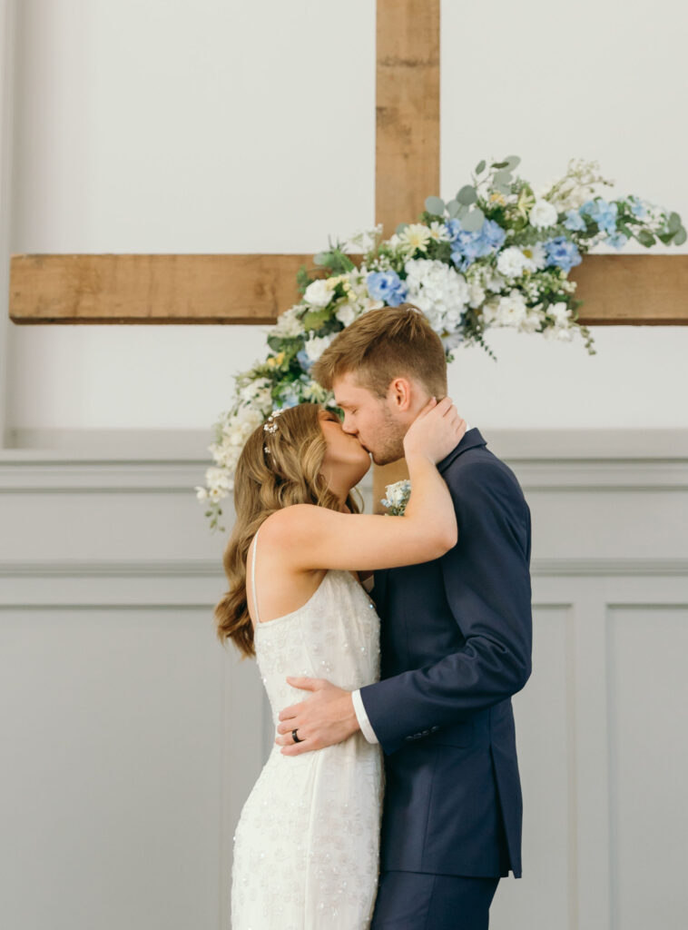 bride and groom first kiss wedding ceremony