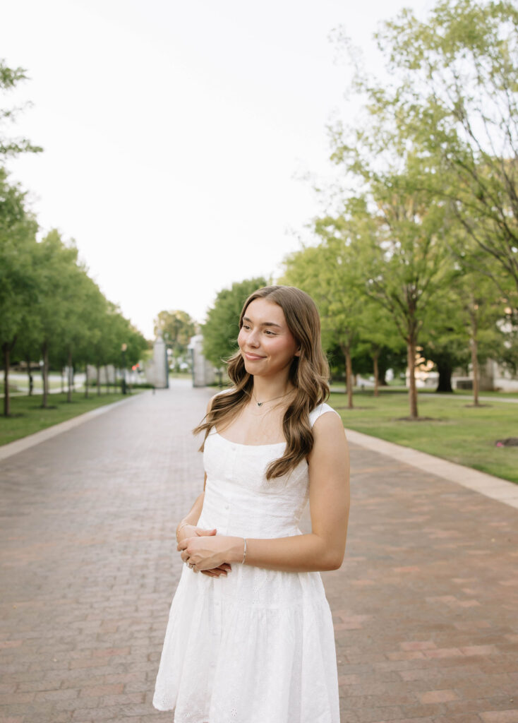 girl posing for senior session at UARK