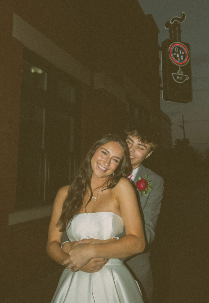 flash wedding photos in front of onyx coffee lab