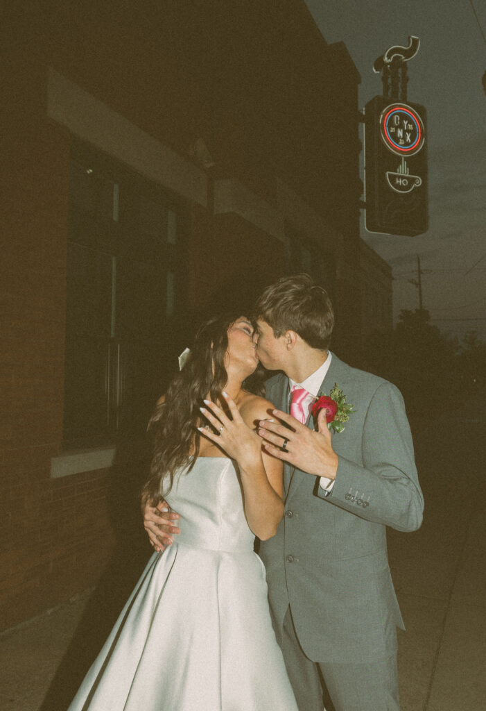 flash wedding photos in front of onyx coffee lab