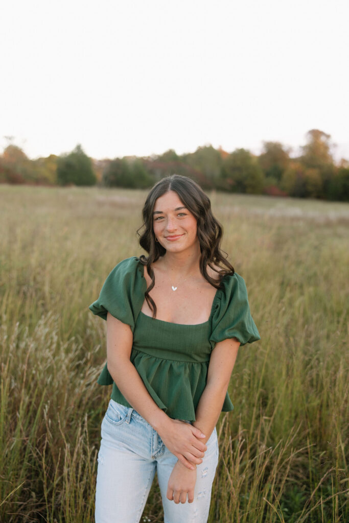 boho senior photos in a field
