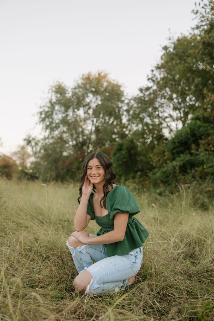 boho senior photos in a field