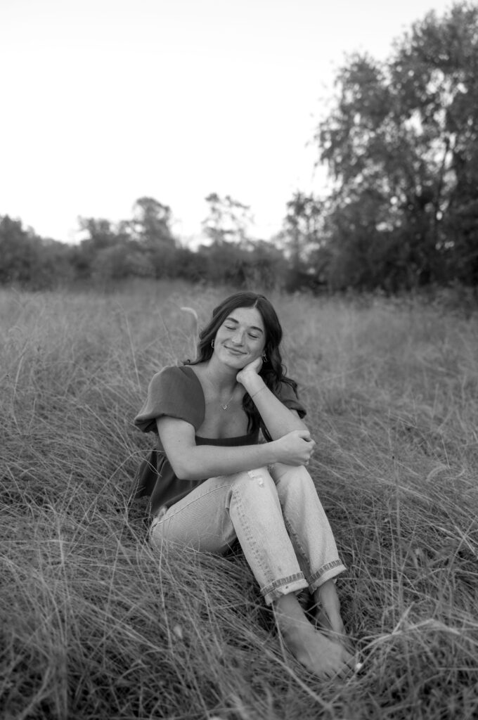 boho senior photos in a field