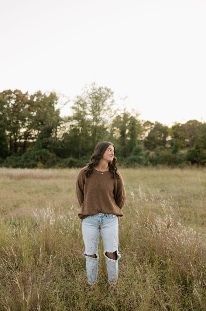 boho senior photos in a field