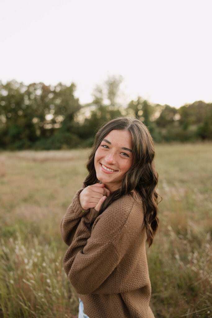 boho senior photos in a field